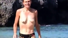 wife topless on beach with small empty saggy tits